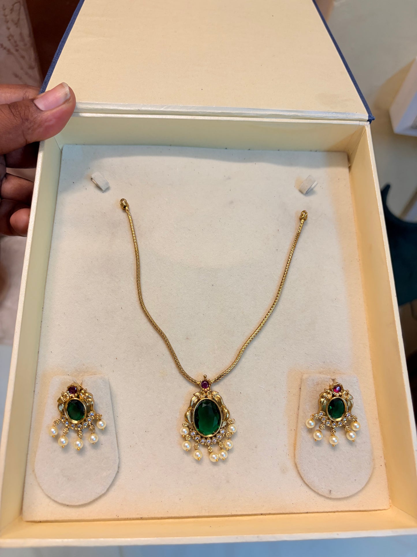 Elegant Emerald necklace set with pearl accents