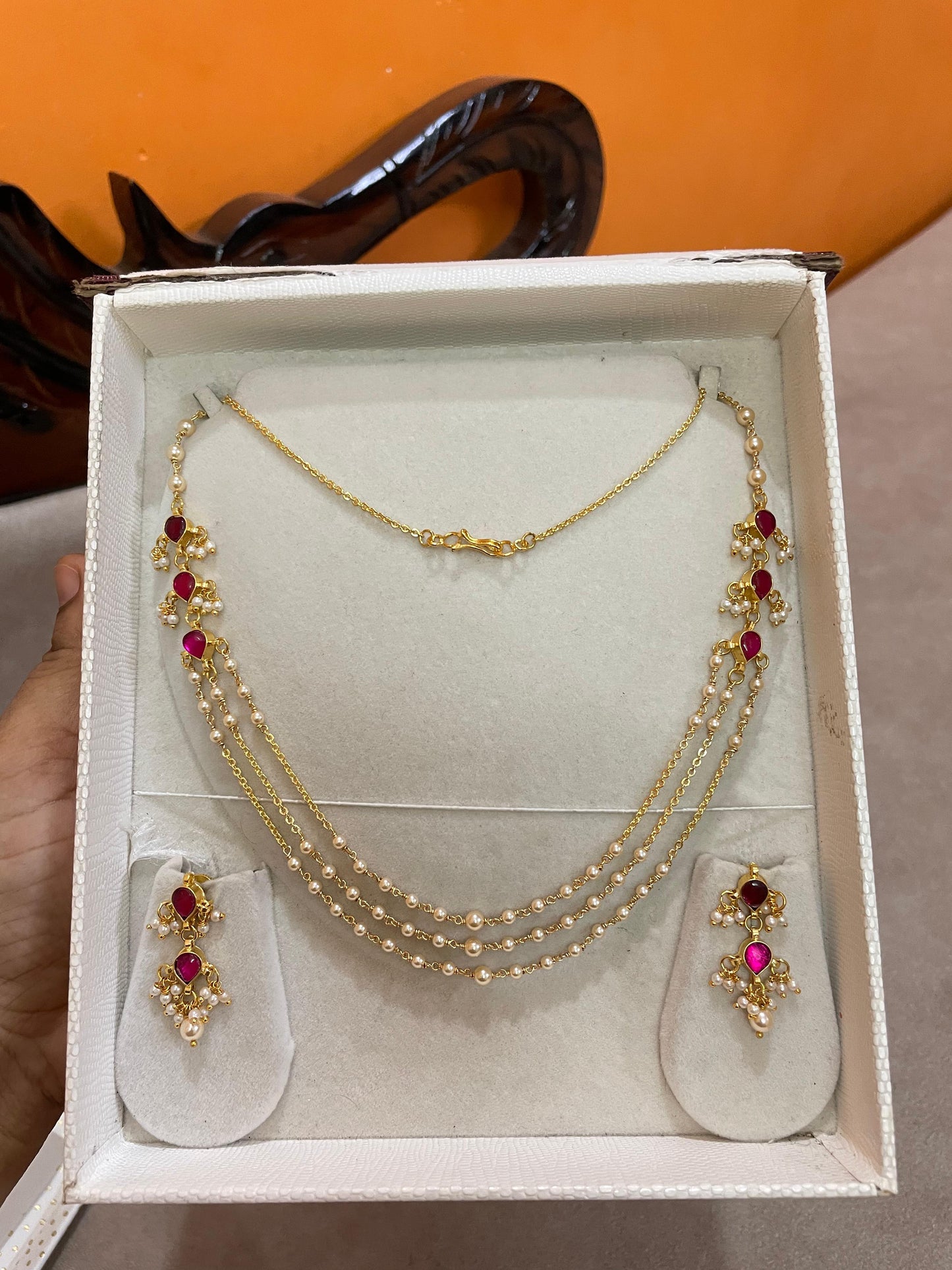 Triple layer pearl mala with ruby accents