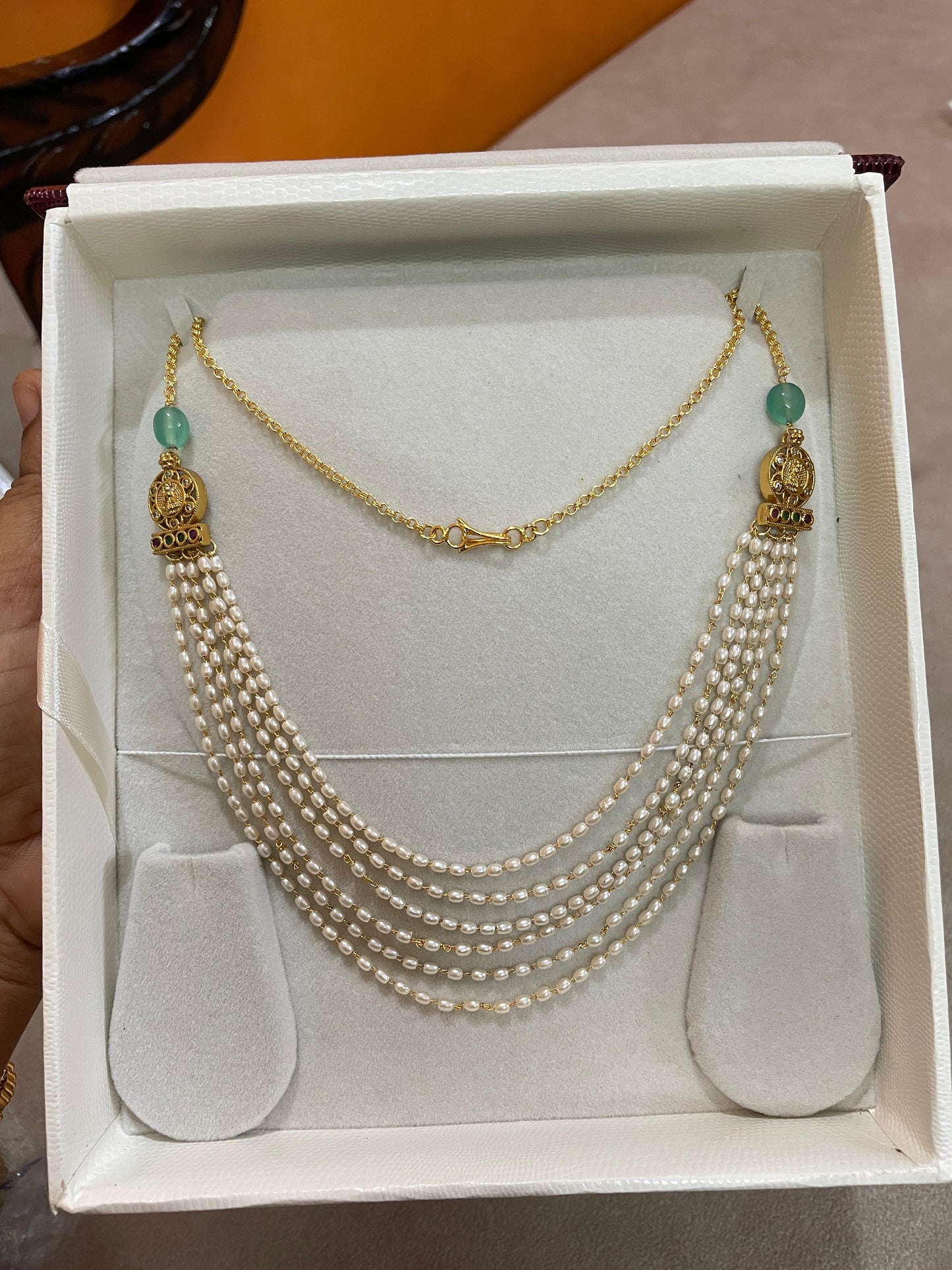 Luminous layers pearl chain with lakshmi motif