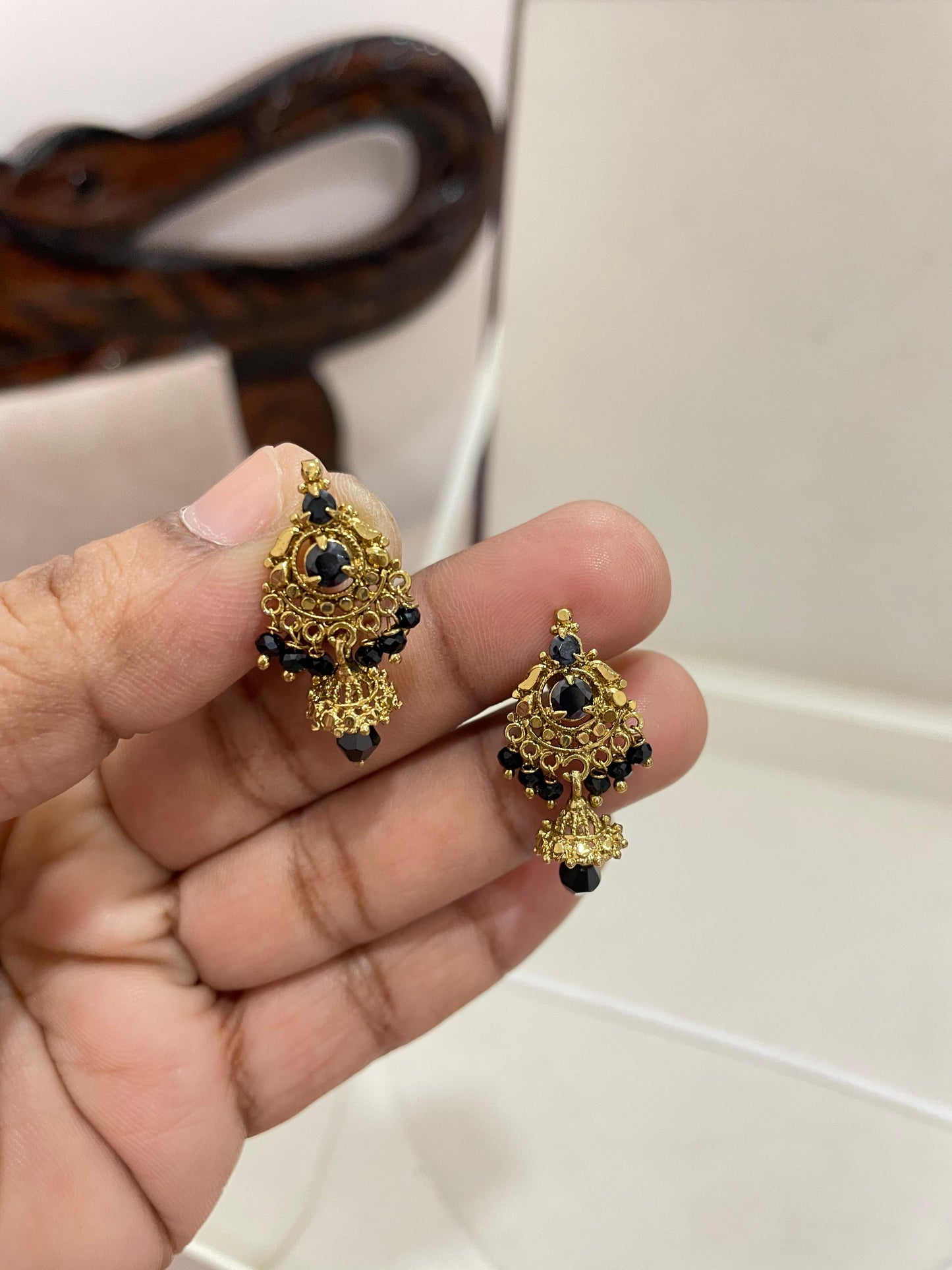 Radiant black beads jhumka earrings
