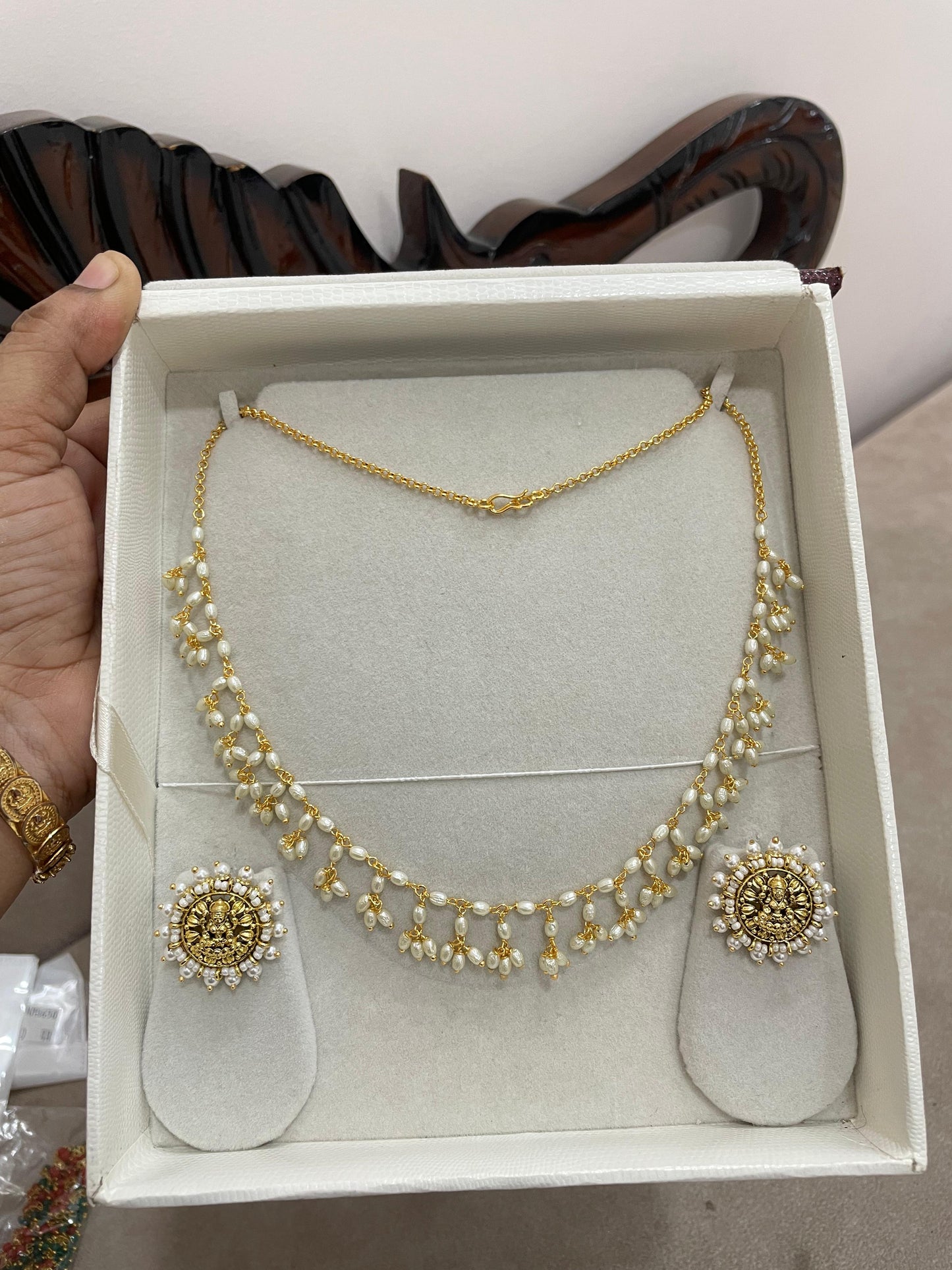 Pearl drop necklace set with lakshmi motif stud