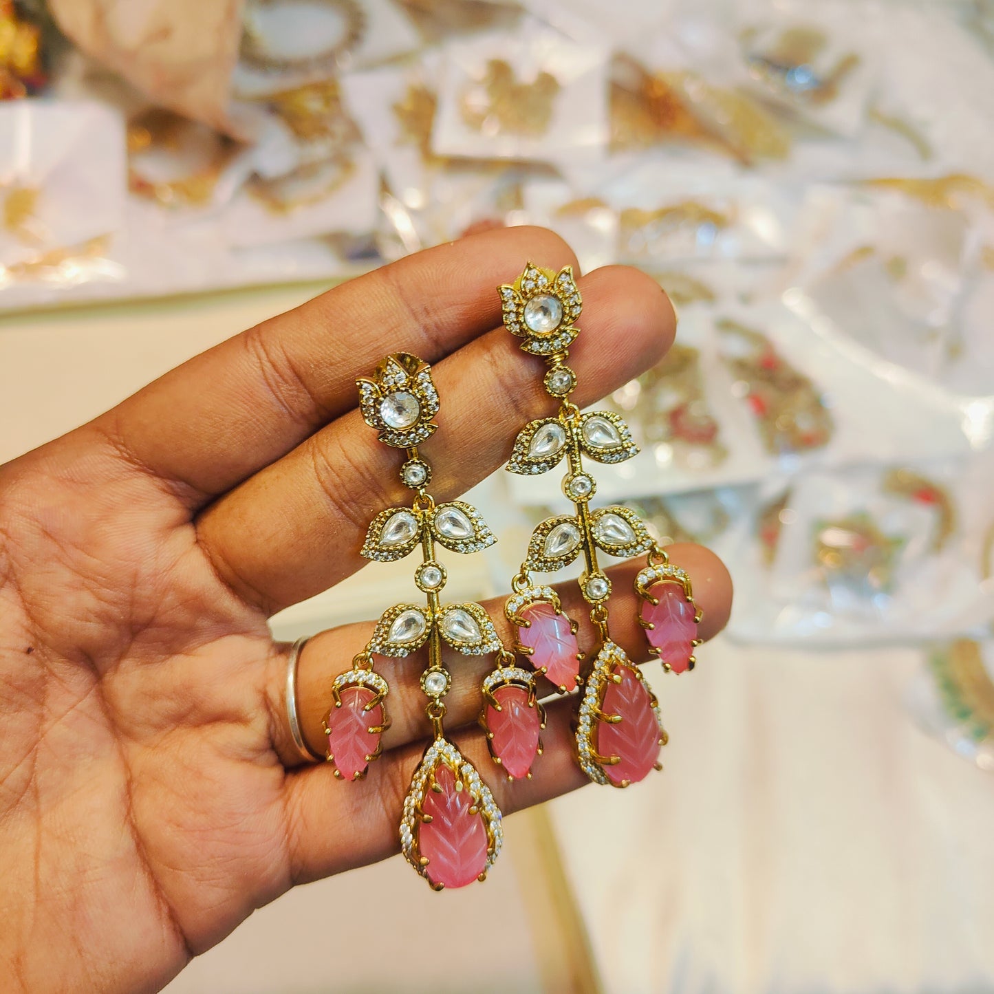 Kundan leaf motif earrings with pink craved stones