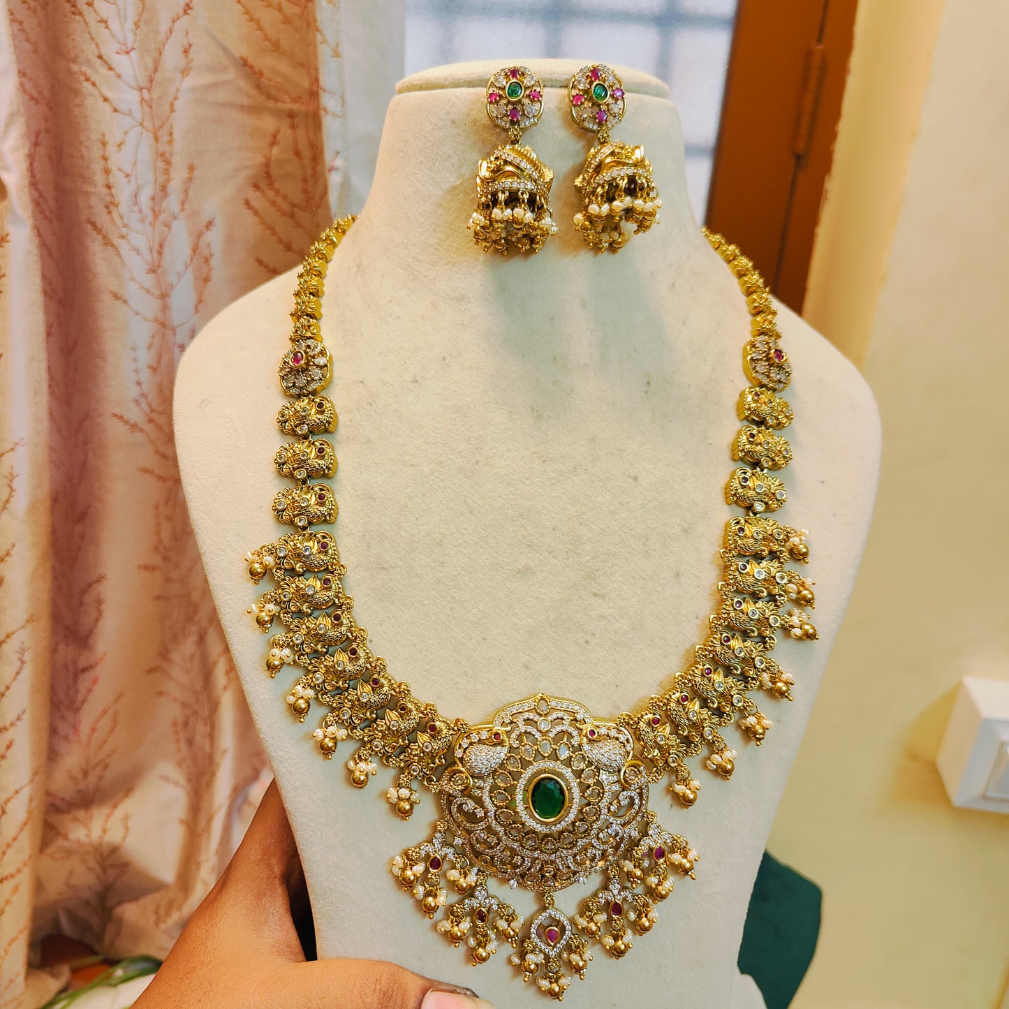 Heritage gold antique nakshi haram with emerald centerpiece
