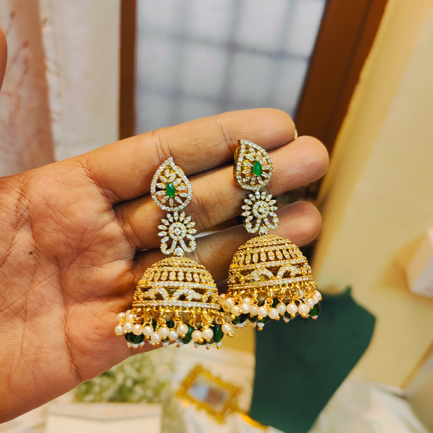 Grand cz jhumka with green beads