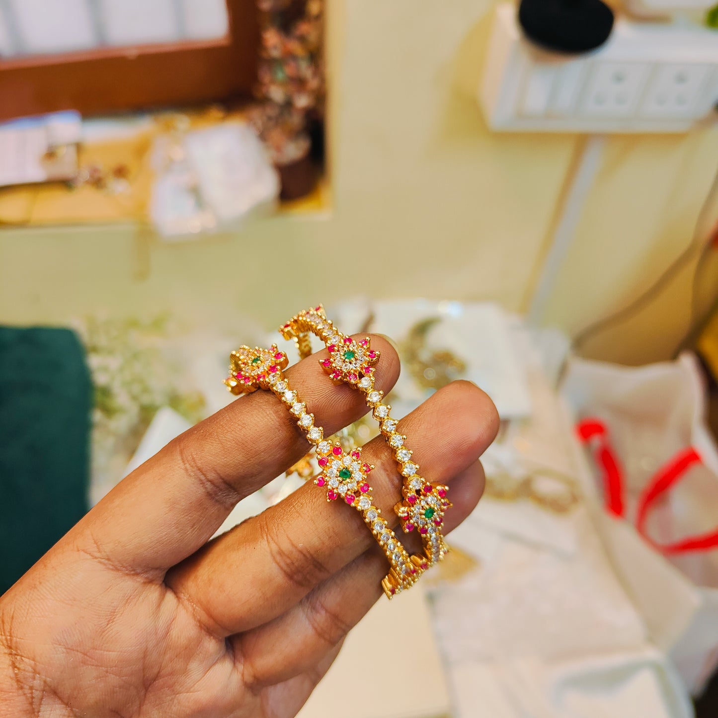 Elegant floral cz bangles with ruby green accents