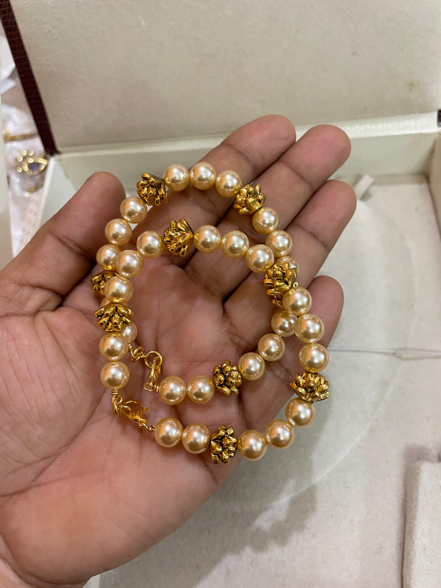 Swarovski pearls gold nakshi balls pair