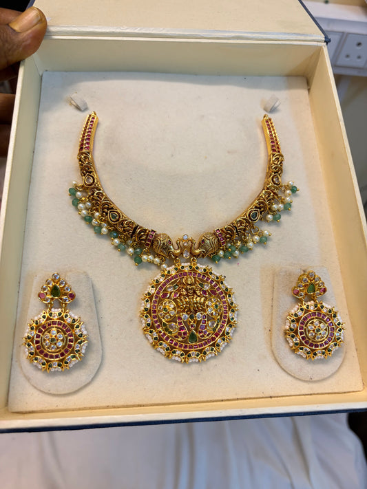 Gold antique finish jadau kemp stones Lakshmi set