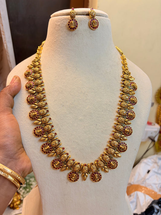 Antique Gold Finish Kemp Stone Lakshmi Motif Long Haram Necklace Set with Earrings