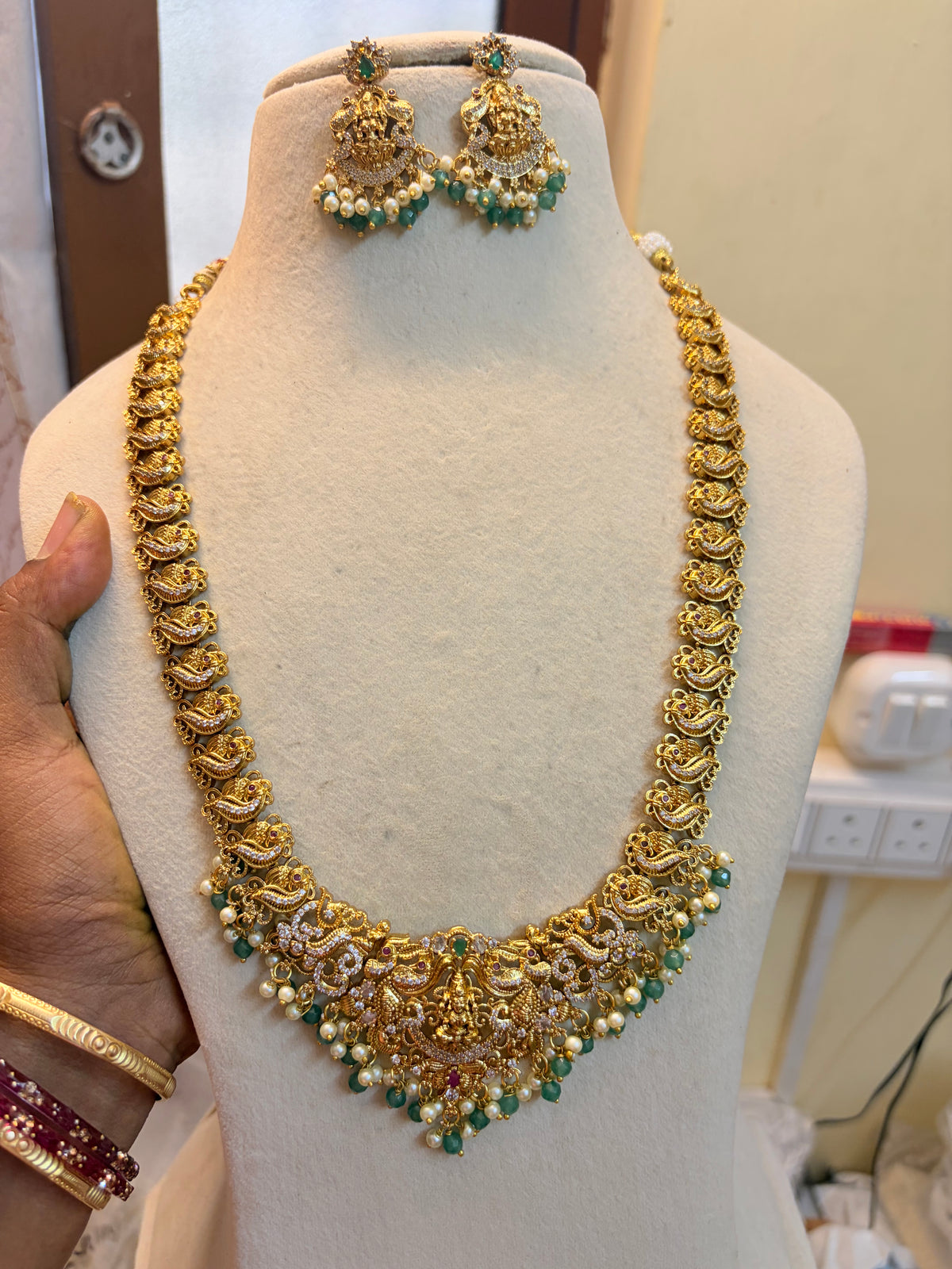Gold Nakshi jadau haram with strawberry beads accents