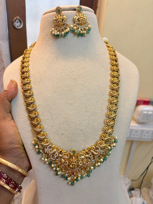 Gold Nakshi jadau haram with strawberry beads accents