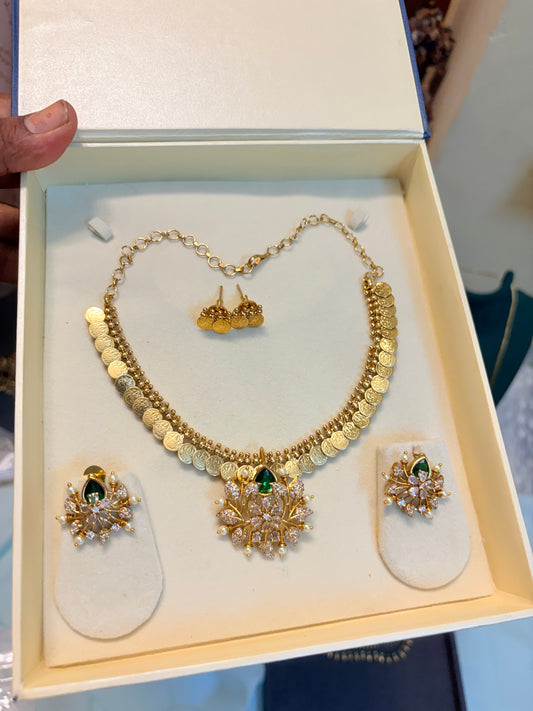 Lakshmi coin necklace set with Cz stone floral motif pendant set