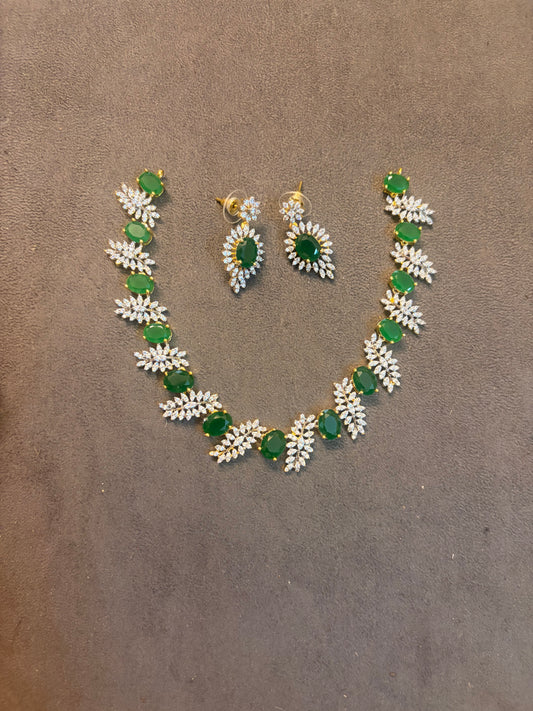 Gj polish leaf motif emerald necklace set