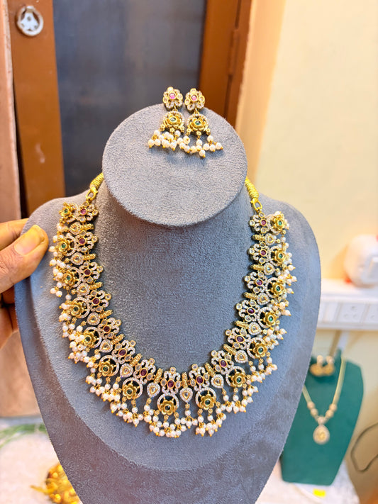 Gold antique finish jadau necklace set with pearl accents