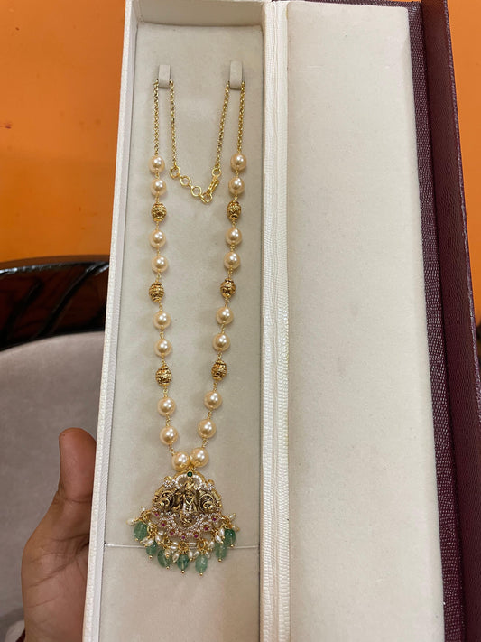 Handmade Swarovski pearls with gold antique finish locket