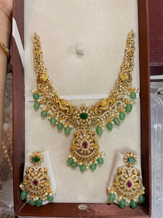 Classic gold nakshi necklace set with green beads