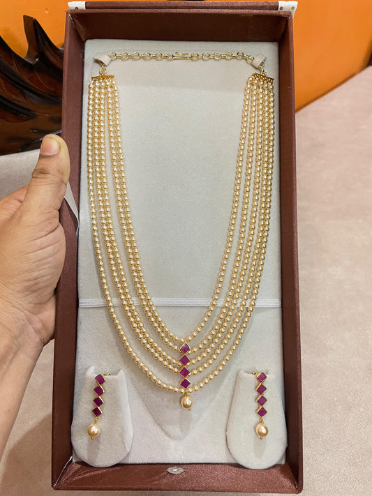 Elegant multi-strand pearl haram with ruby accents