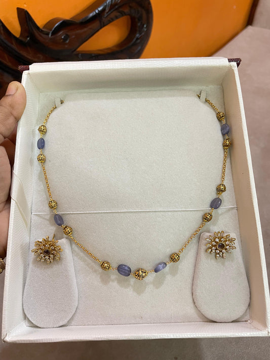Golden violet beads chain with sunburst stud