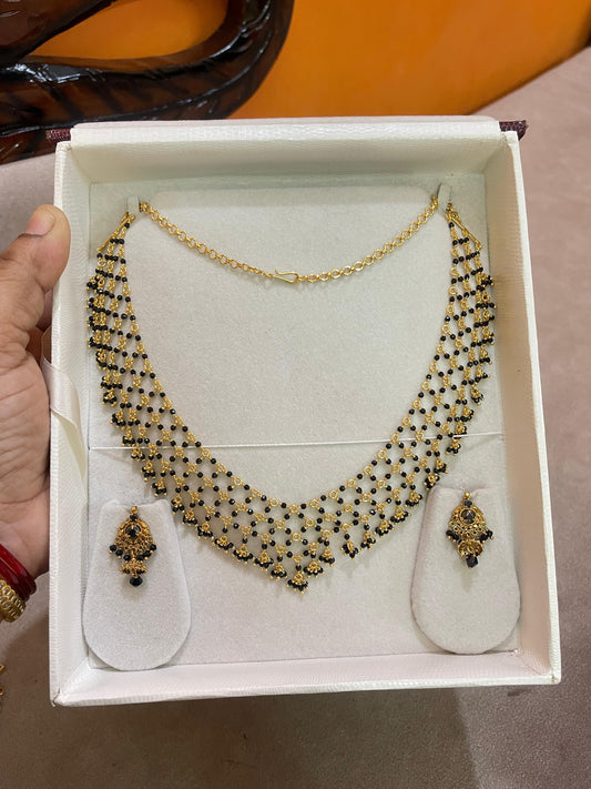 Black zali chain with gold replica earrings
