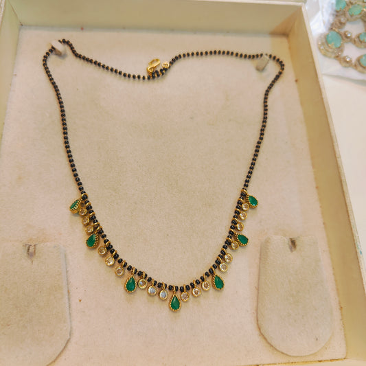Elegant emerald polki droplets black beads chain