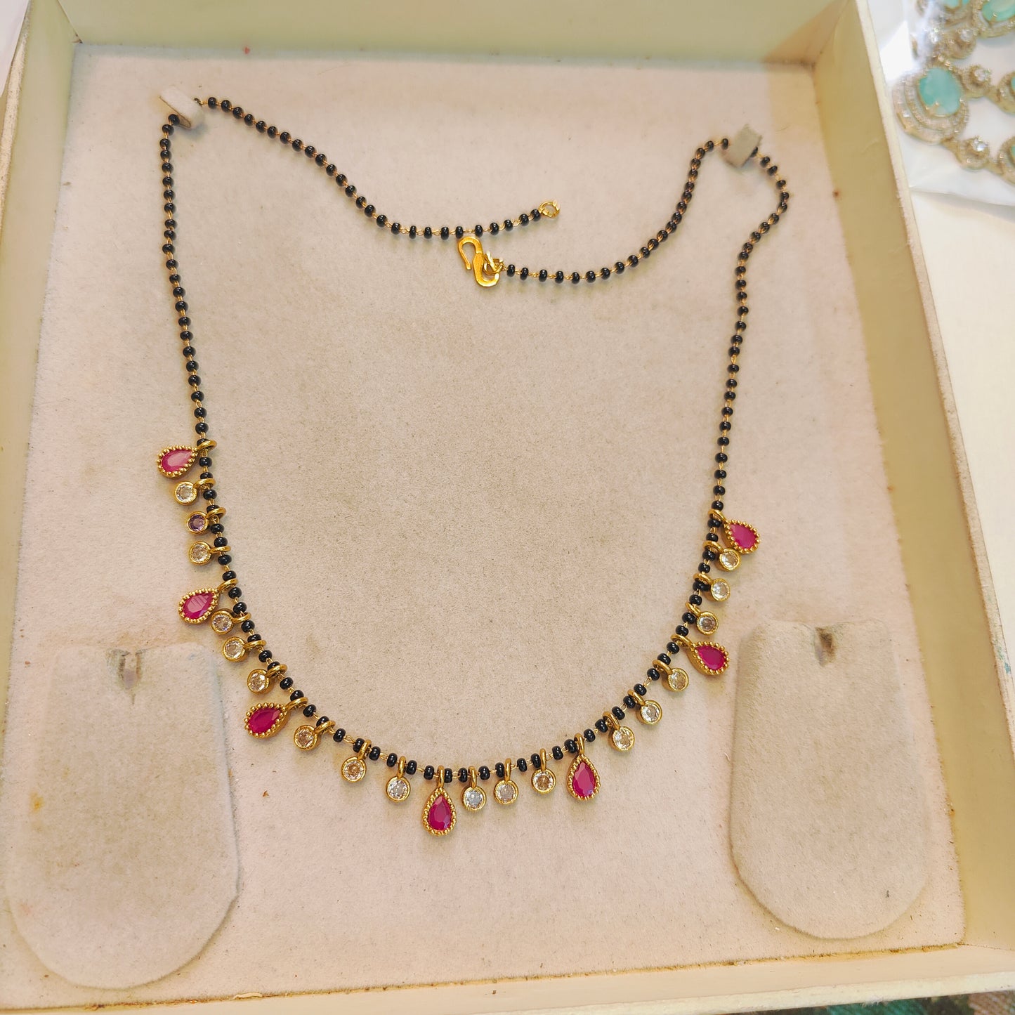 Elegant red polki droplets black beads chain