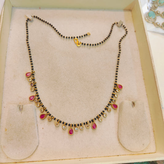 Elegant red polki droplets black beads chain