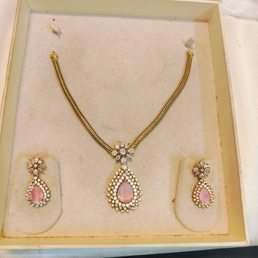 Floral pendant necklace set with pink accent