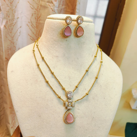 Elegant dual layer chain with pink teardrop pendant