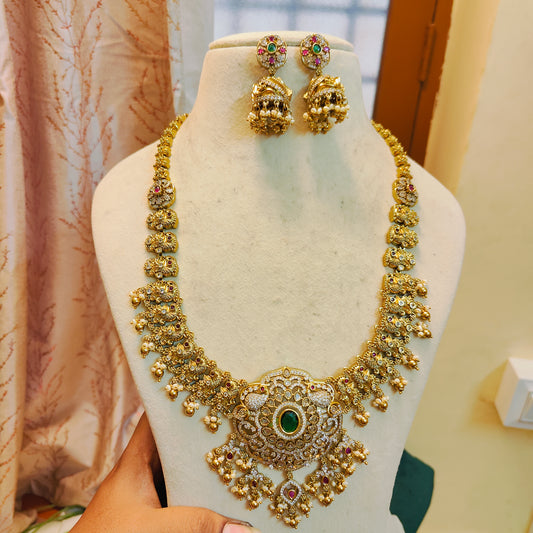 Heritage gold antique nakshi haram with emerald centerpiece
