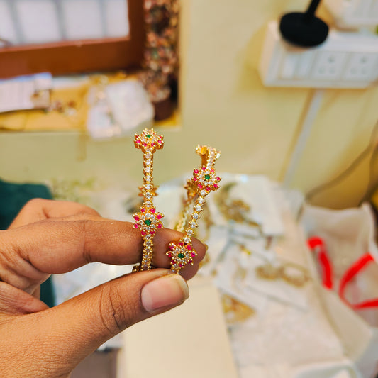 Elegant floral cz bangles with ruby green accents