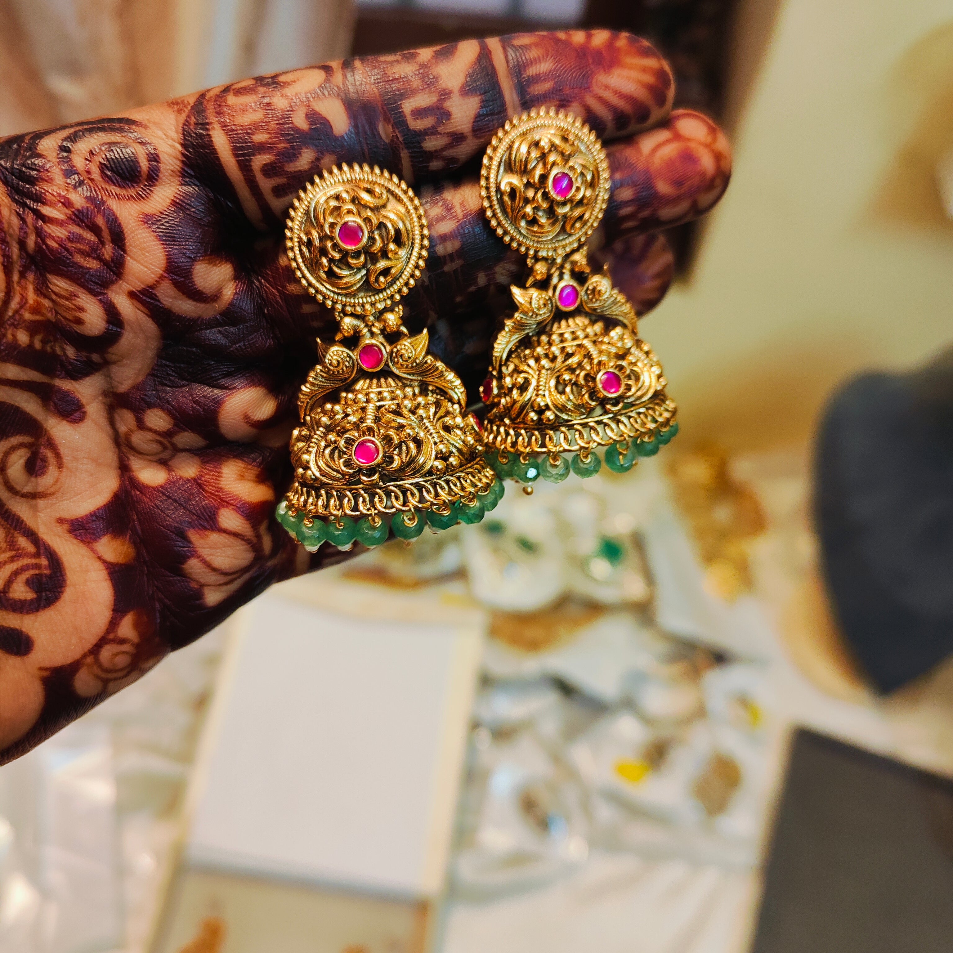 Vintage inspired gold antique jhumka with emerald beads accent