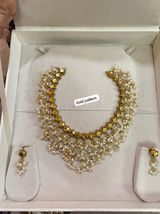 Gold antique nakshi finish with rice pearls neckset premium quality