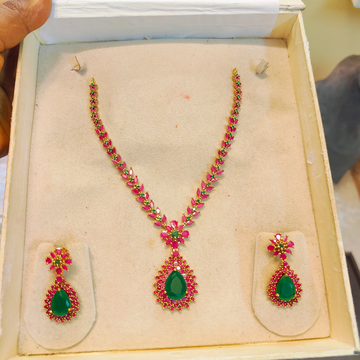 Ruby pink jadau necklace set with emerald accents