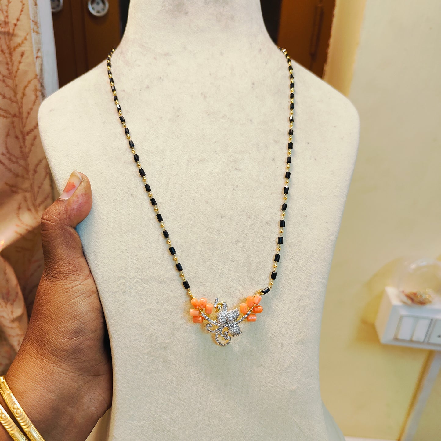 Floral cz pendant black beads chain 18 to 20 inches